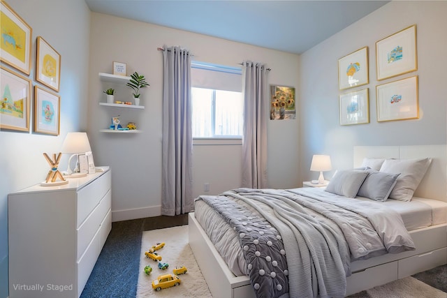 bedroom with dark colored carpet