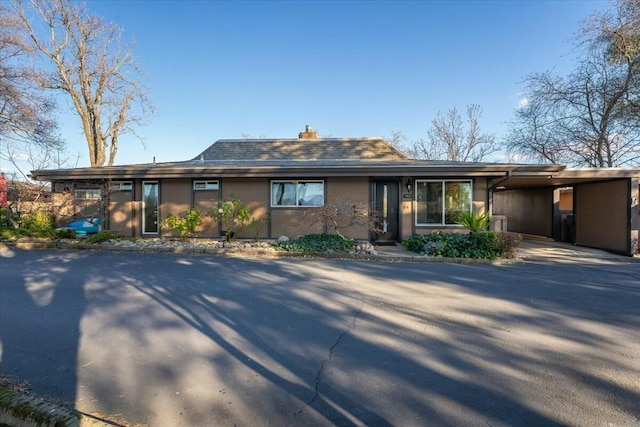 view of front of house with a carport