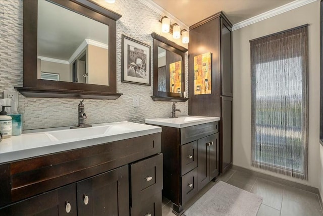 bathroom featuring tasteful backsplash, ornamental molding, and vanity