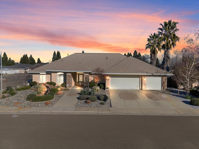 ranch-style home featuring a garage