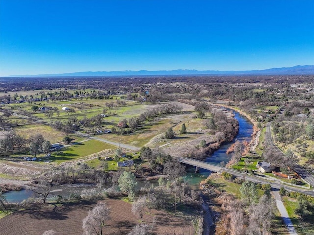 drone / aerial view featuring a mountain view