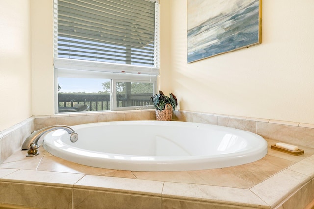 bathroom featuring tiled bath