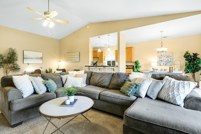 living room with lofted ceiling, sink, ceiling fan with notable chandelier, and light colored carpet