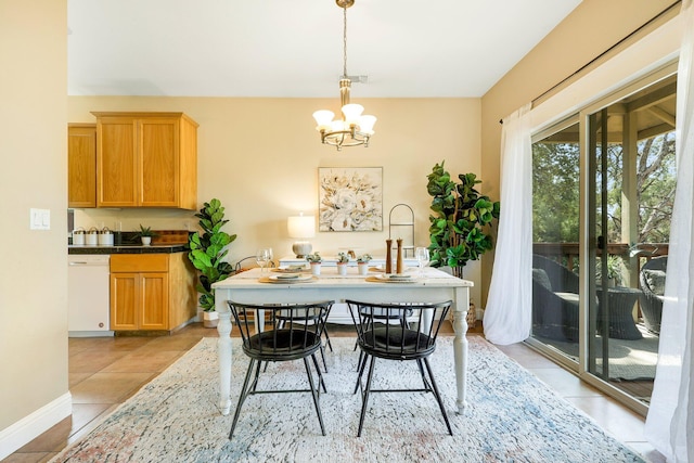 dining area featuring light tile patterned floors and a notable chandelier