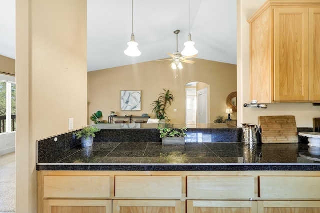 kitchen featuring ceiling fan, lofted ceiling, and light brown cabinets