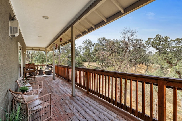 deck featuring an AC wall unit