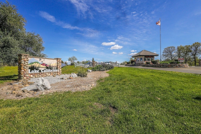 surrounding community with a gazebo and a yard