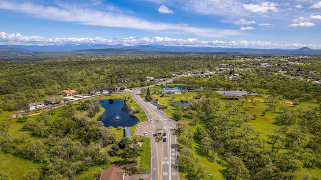 bird's eye view with a water and mountain view