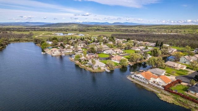 bird's eye view with a water and mountain view