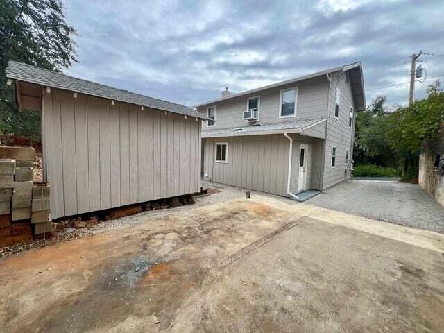 back of property featuring a patio