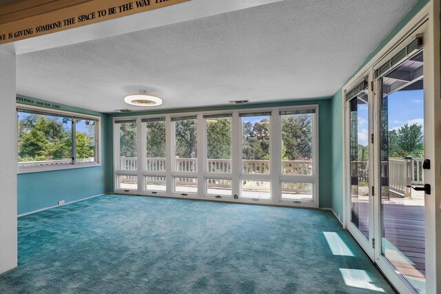 unfurnished sunroom with a wealth of natural light