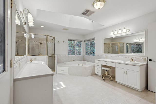 full bathroom featuring a shower stall, a garden tub, vanity, tile patterned flooring, and visible vents