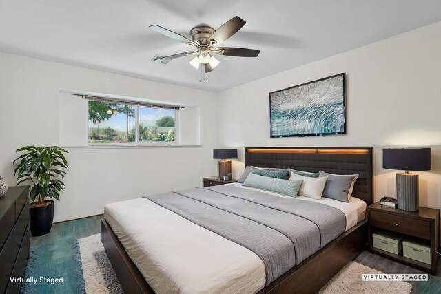 bedroom featuring a ceiling fan and wood finished floors