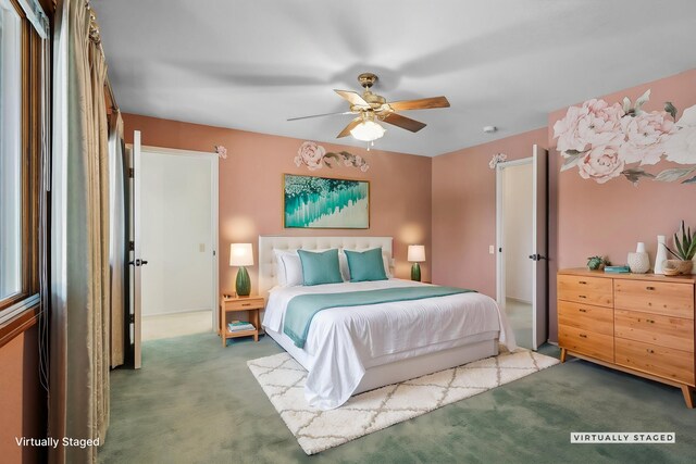 carpeted bedroom with a ceiling fan