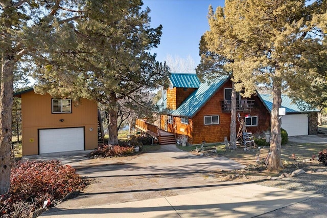 view of front facade with a garage and a deck