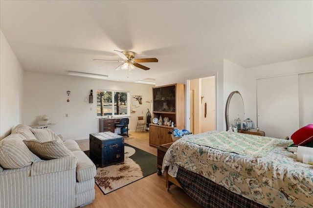 bedroom with ceiling fan and light hardwood / wood-style floors