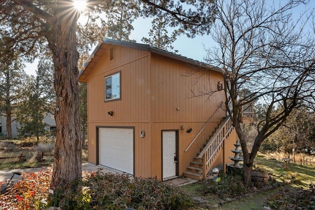 rear view of house with a garage