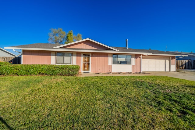 ranch-style home featuring a garage and a front lawn