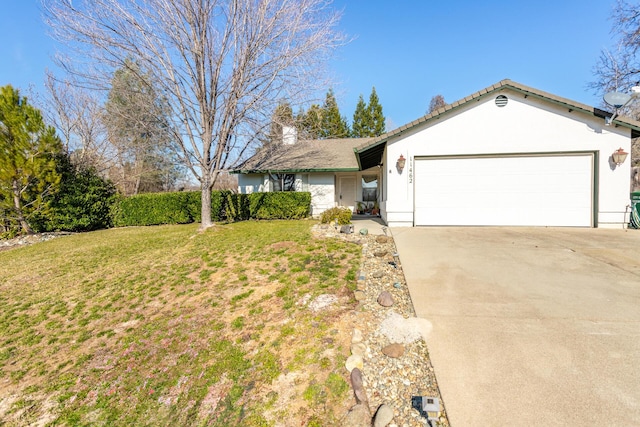 single story home with a garage and a front yard