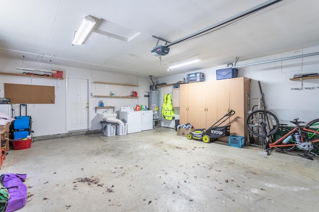 garage featuring water heater, a garage door opener, and independent washer and dryer