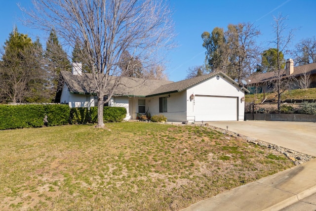 ranch-style house with a garage and a front lawn