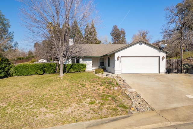 single story home with a garage and a front yard