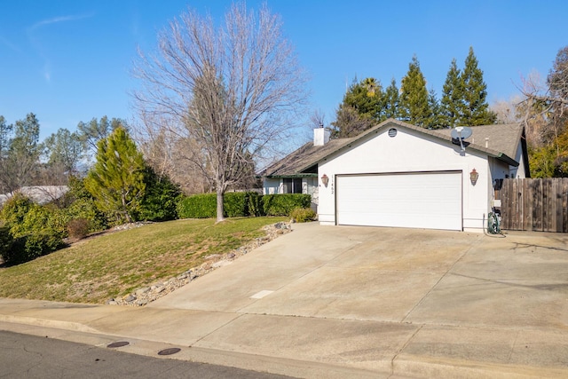 view of side of property featuring a garage and a yard