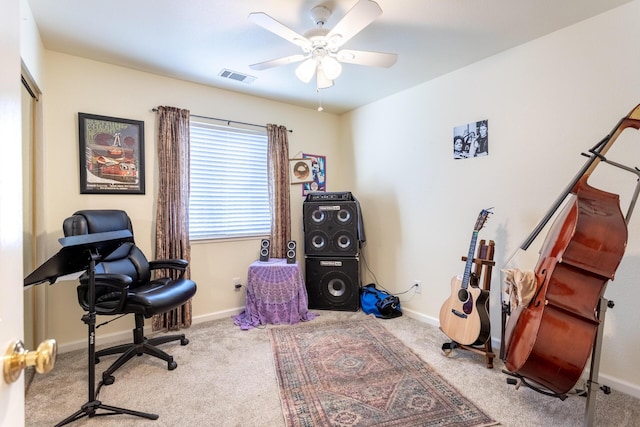 office space with light carpet and ceiling fan