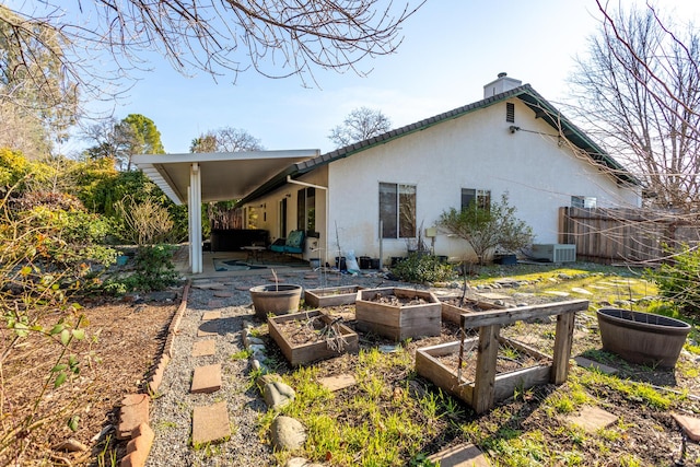 rear view of property featuring a patio area