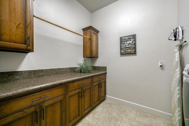 interior space with vanity and tile patterned flooring