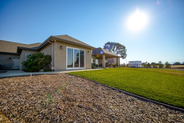 exterior space with a yard and a patio area