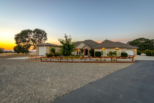 single story home featuring a garage