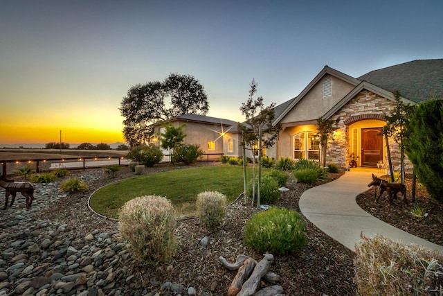 view of front of property with a lawn