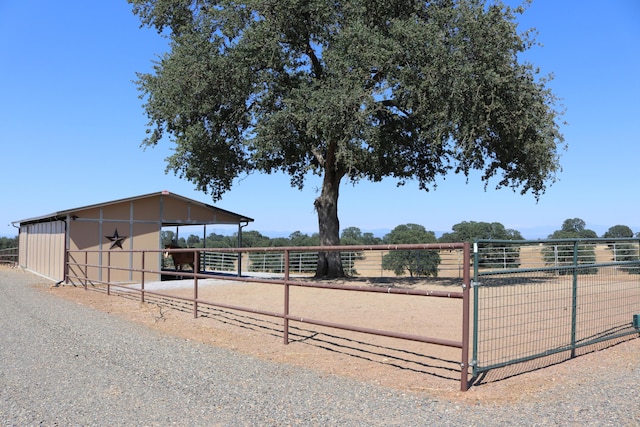 view of stable featuring a rural view