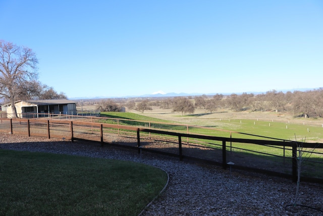 view of yard with a rural view