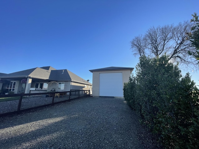 view of yard with an outbuilding and a garage