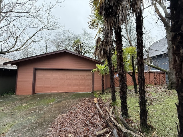 exterior space featuring a garage and an outdoor structure