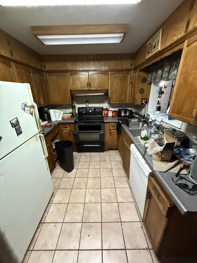 kitchen with light tile patterned floors, white appliances, and decorative backsplash