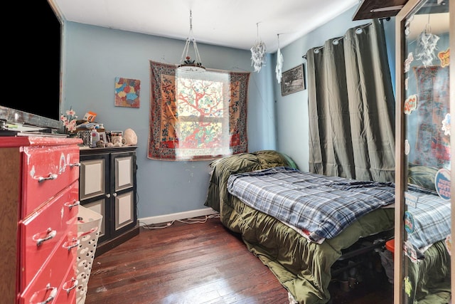 bedroom featuring dark wood-type flooring