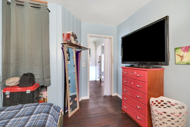 bedroom featuring dark wood-type flooring