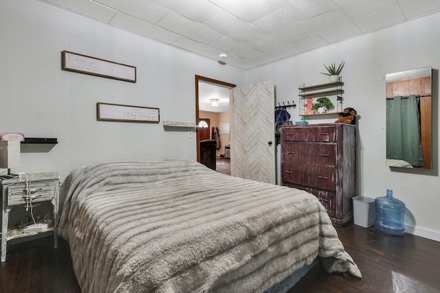 bedroom featuring dark hardwood / wood-style flooring