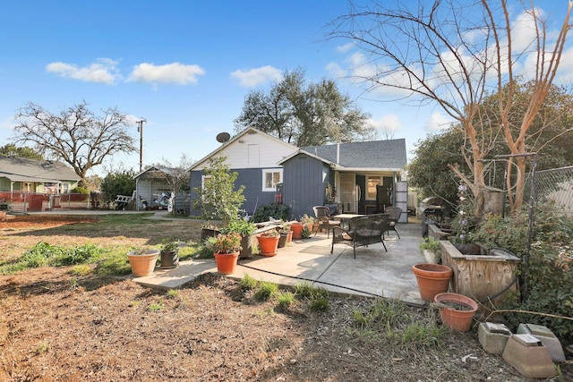 back of property featuring a patio area