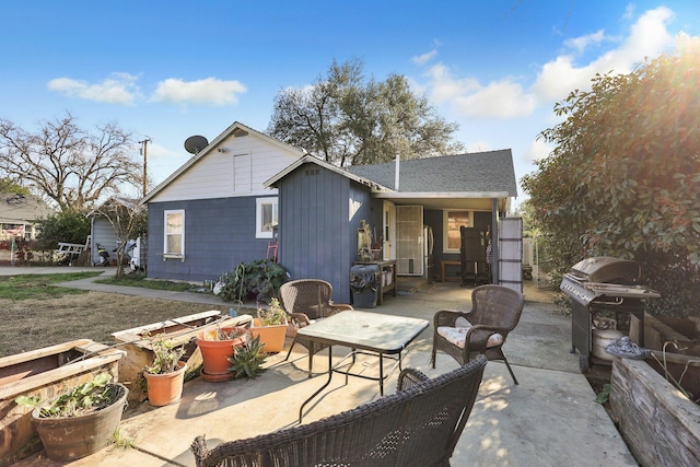 back of property featuring a patio area