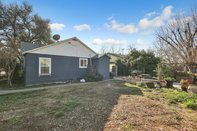 view of home's exterior featuring a yard