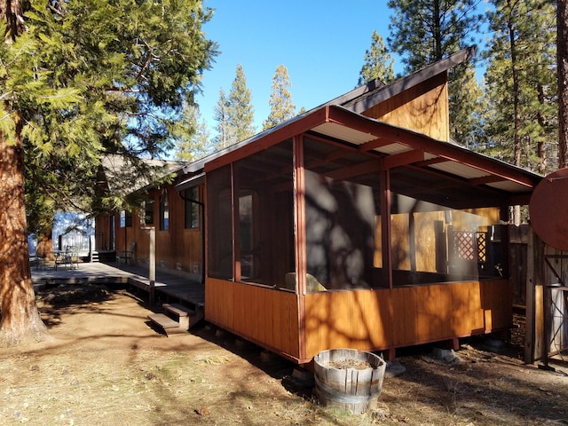 view of home's exterior featuring a sunroom