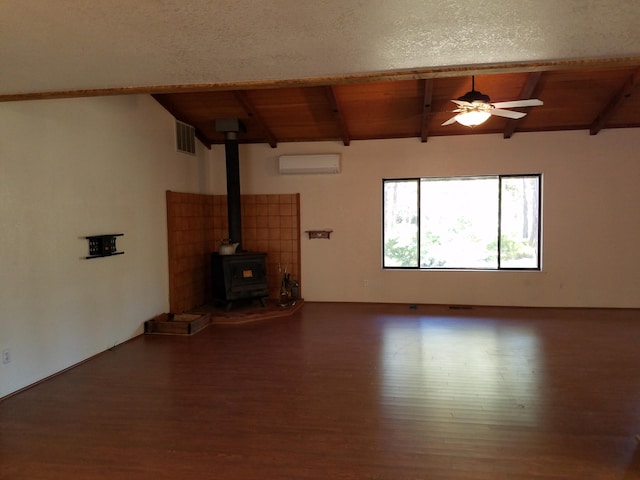 unfurnished living room with vaulted ceiling with beams, wooden ceiling, and a wood stove