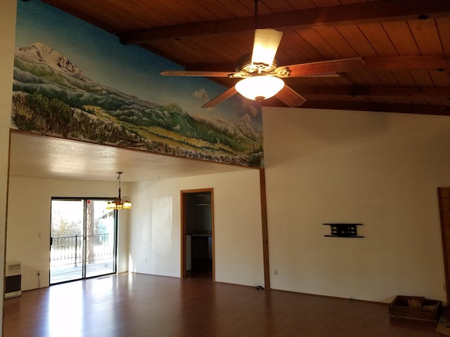 spare room with ceiling fan with notable chandelier, beamed ceiling, wooden ceiling, and wood finished floors