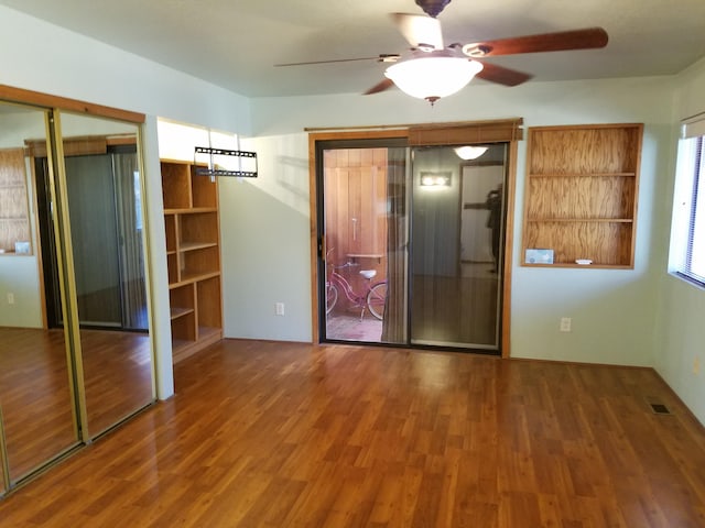 interior space featuring wood finished floors and visible vents