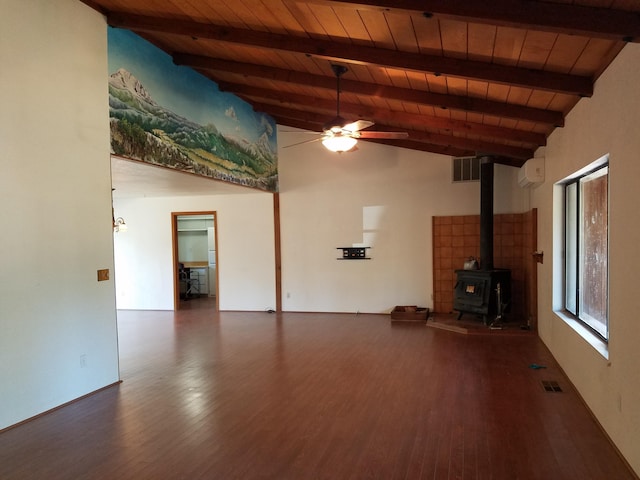 unfurnished living room with a wood stove, wooden ceiling, visible vents, and beam ceiling