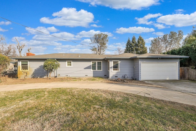 ranch-style home with a garage and a front lawn